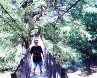 Sean Crossing the Hanging Bridge over the Hualahuises River